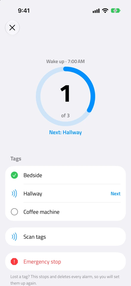 The alarm ringing: Wake up, 7:00 AM, 1 of 3 scanned, next Hallway, with Scan tags and Emergency stop